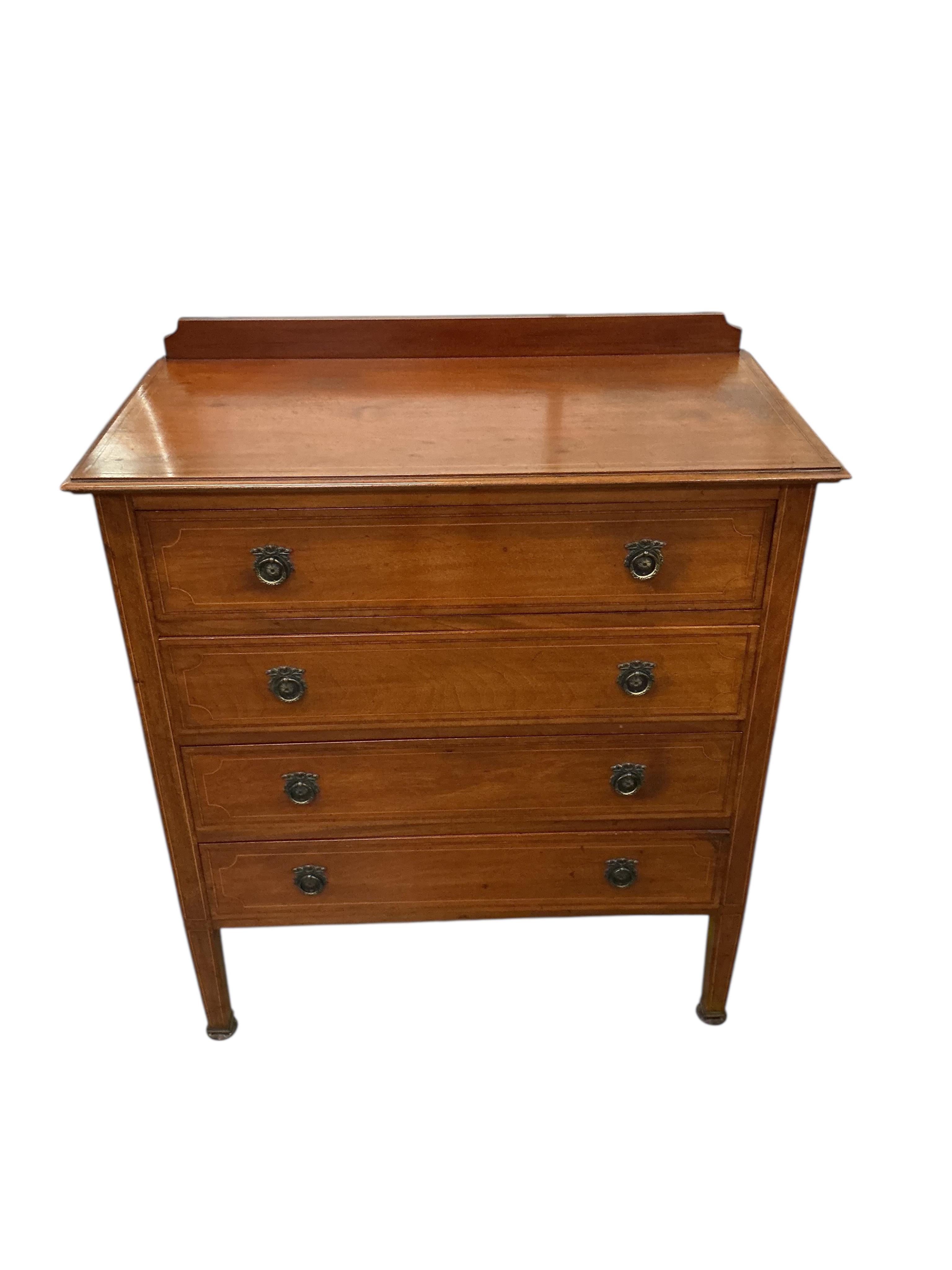 An Edwardian inlaid mahogany dressing table and matching chest of four drawers, larger width 124cm, depth 56cm, height 175cm